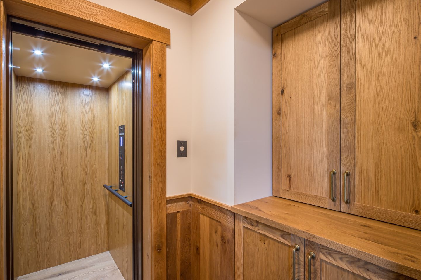 Main level elevator entry millwork — Montana private residence